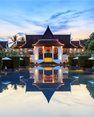 a building with a pool in front of it