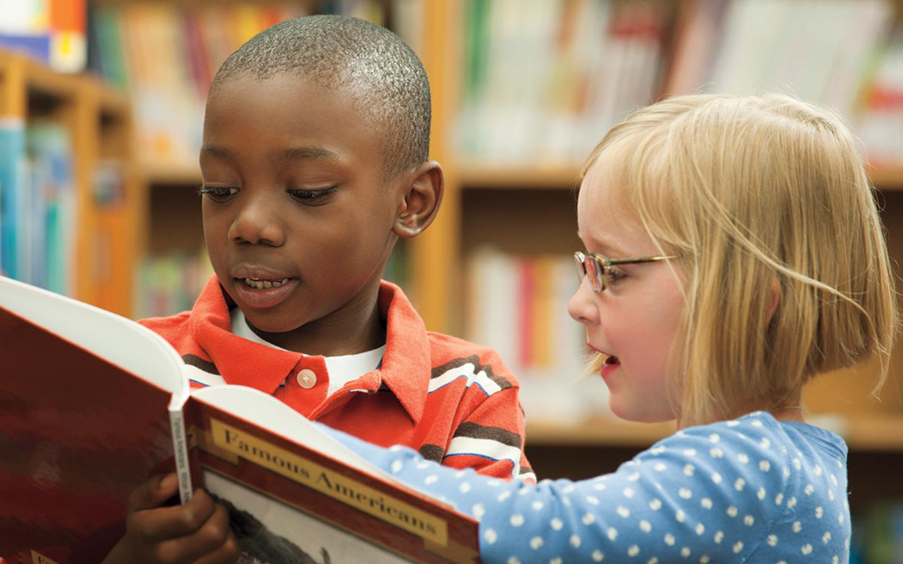 kids reading in a library 