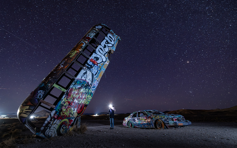 The International Car Forest of the Last Church in Goldfield, Nevada is not your typical forest—instead of leafy trees reaching skyward, dozens of colorfully painted, graffiti-covered automobiles stand dramatically in the desert soil.