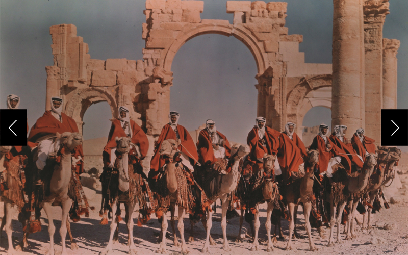A Syrian desert patrol on camelback visits the ruins of Palmyra in a 1938 Dufaycolor.