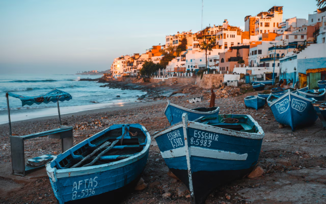 Boats on a small beach in Taghazout, Morocco.