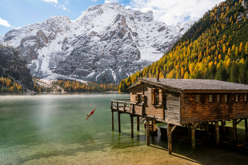 A person dives into Lago di Braies (Lake Braies) in the Tyrol. 