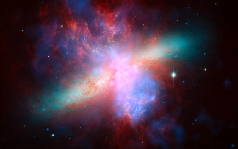 NASA Spitzer, Hubble and Chandra space observatories teamed up to create this multi-wavelength, false-colored view of the M82 galaxy.