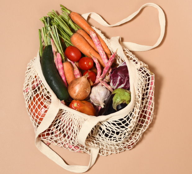A bag of vegetables and fruit. 