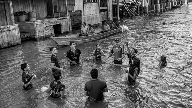 Residents of Anamã, a town on an Amazon River floodplain, played volleyball in waist-high water