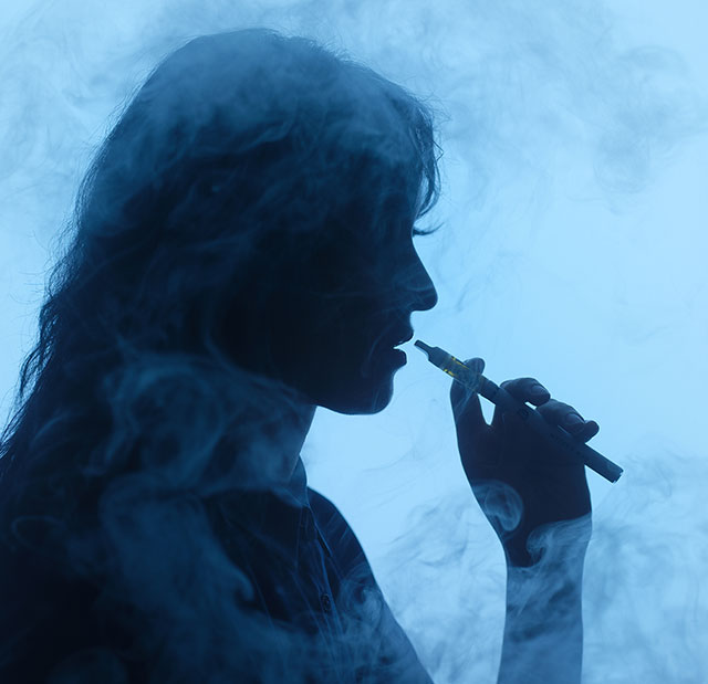 A woman with a vape pen