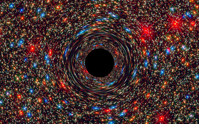 This computer-simulated image shows a supermassive black hole at the core of a galaxy.