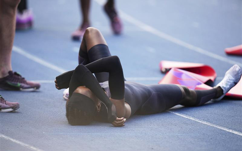 Faith Kipyegon, from Kenya, lies on the track after crossing the finish line in her attempt to become the first woman to run a mile in under four minutes, at Stade Charlety in Paris, Thursday, June 26, 2025.