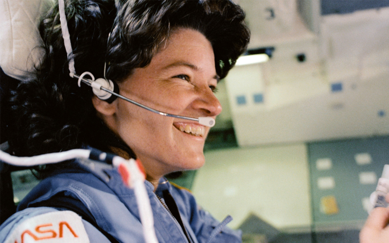 Sally Ride is pictured sitting in the aft flight deck mission specialist's seat during deorbit preparations.