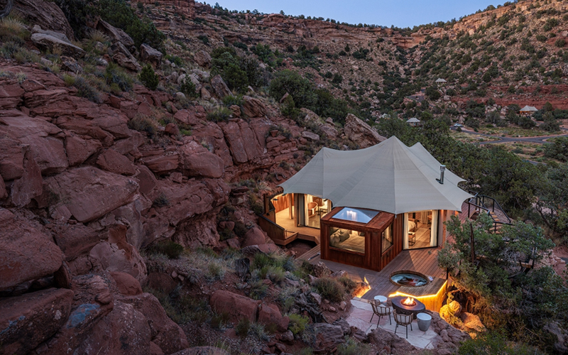 A glamping tent in Zion National Park features a glass ceiling over the bed to stargaze.