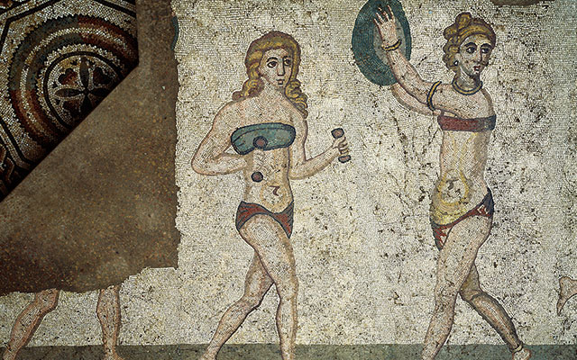Roman women in a fourth-century A.D. mosaic from Sicily compete in an athletic contest while wearing an amictorium, a bandeau-type linen garment that bound the breasts.