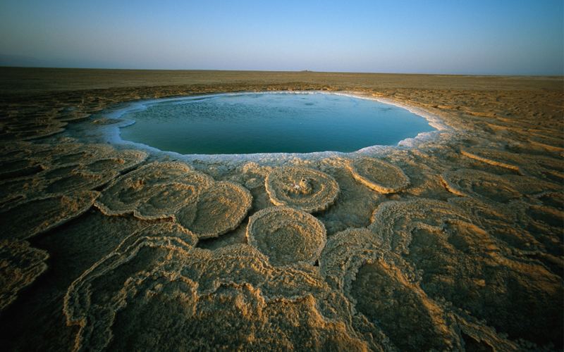 The sunrise over the discs of travertine—large, naturally formed calcite deposits in Ethiopia’s Danakil Depression.