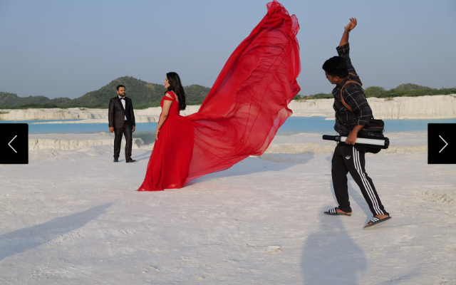  A couple staging an engagement photoshoot