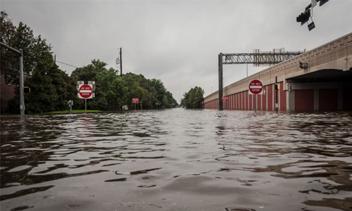 National Geographic photographer Erin Trieb photographed floodwaters at the intersection of Highway 610 and Evergreen Street in Bellaire, Texas, after evacuating her family during Hurricane Harvey.