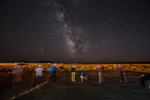 Visitors to DarkSky International look up at the night sky