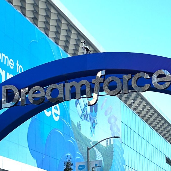 Entrance to Dreamforce, with a large blue arch and “Dreamforce” signage outside the conference venue.