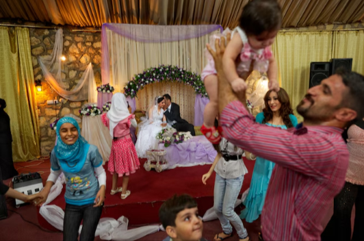A lavish wedding celebration in 2011 depicted how life had changed for Iraqis in Baghdad years after war divided their city