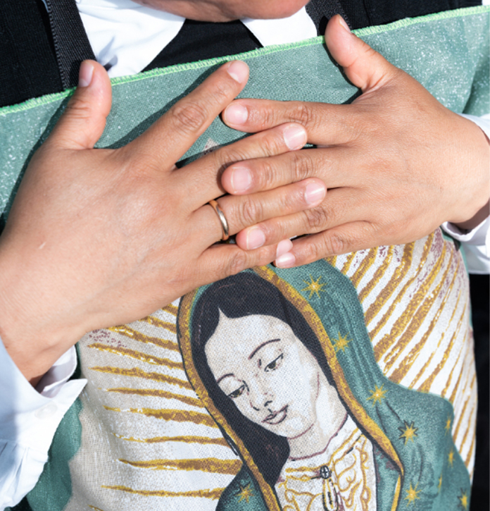 A nun holds an image of the Lady of Guadalupe while waiting for arrival of the new Pope in St Peter's square. 