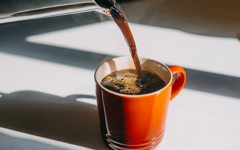 Coffee being poured into a cup