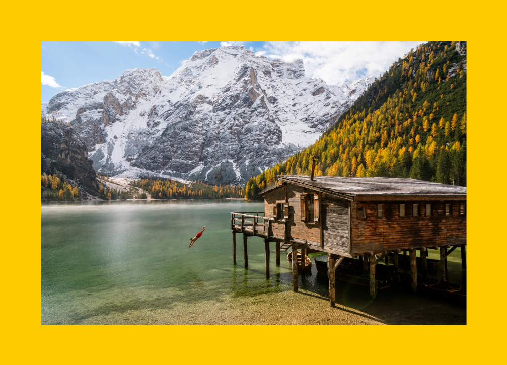 A person dives into Lago di Braies (Lake Braies) in the Tyrol. 